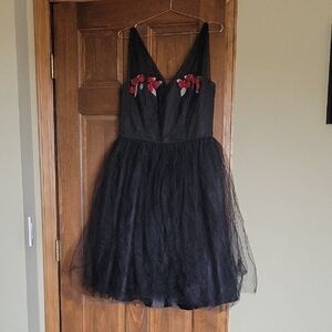Elegant Black Dress with Red Floral Accents